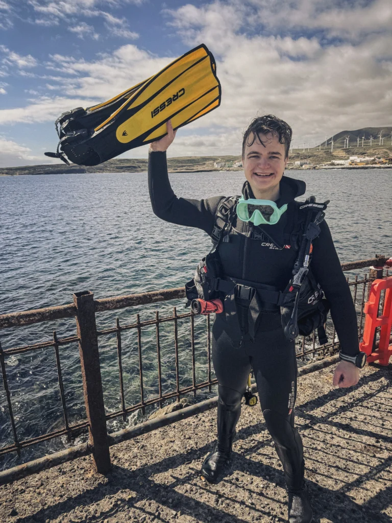 Newly certified Open Water Diver celebrating
