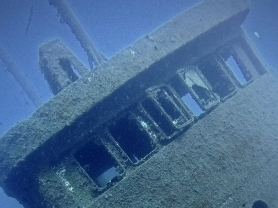 Close up of a sunken shipwreck covered in algae and surrounded by fish, SSI Wreck Diving Specialty Tenerife, Barbarian Diving